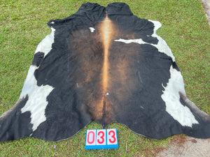 33. Black White Red Cowhide
