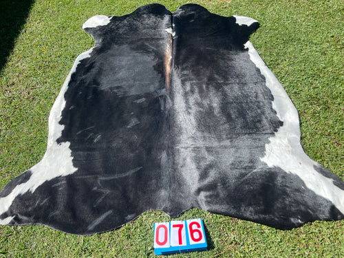 76. Black White Reddish Cowhide