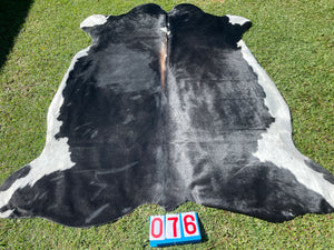 76. Black White Reddish Cowhide