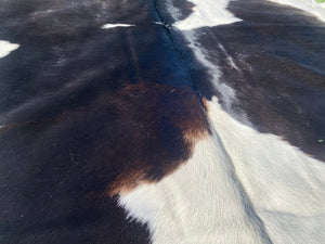 a170. Deep Choc and White Cowhide