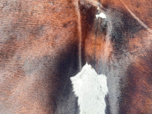 70. Black white and red Cowhide
