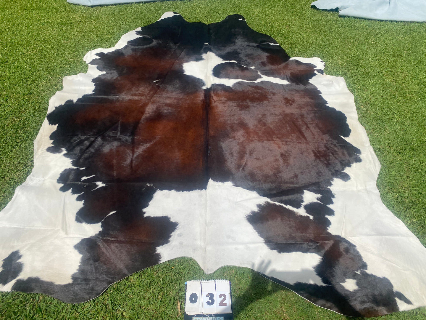 32. Black White Reddish Cowhide