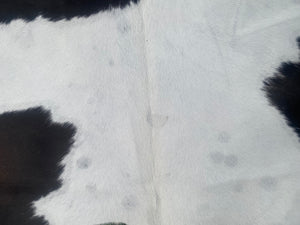 32. Black White Reddish Cowhide