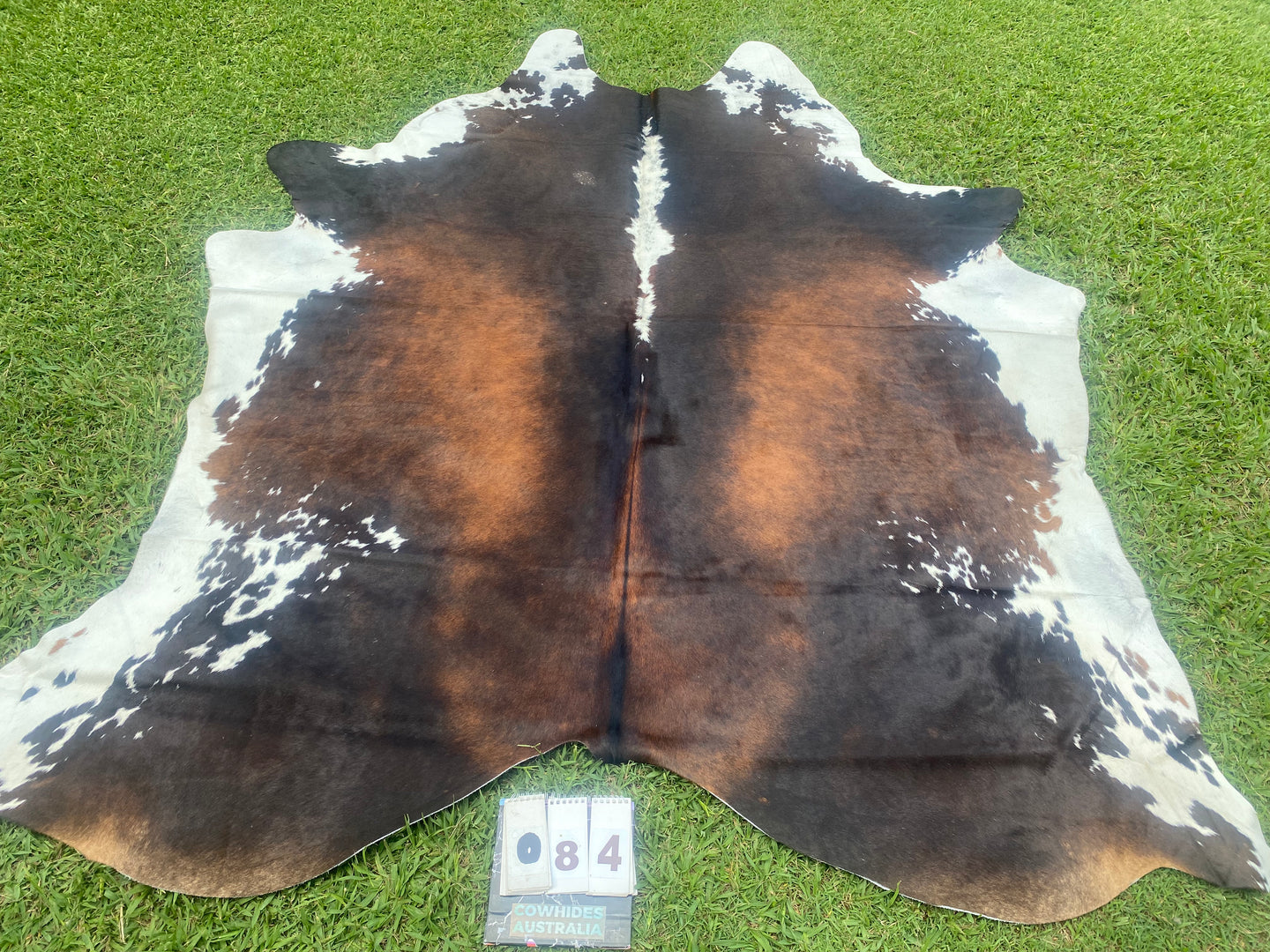 84. Black white reddish Cowhide