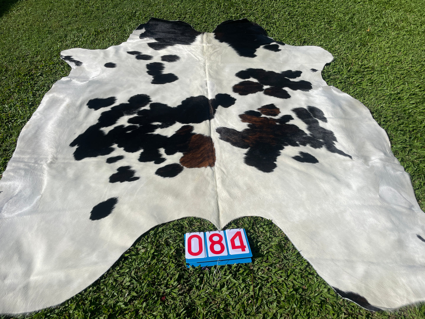 84. Black white reddish Cowhide
