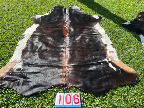 a106. Black white reddish  Cowhide