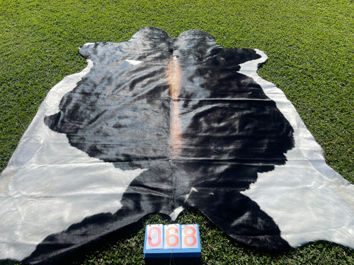 68. Reddish Black and White Cowhide